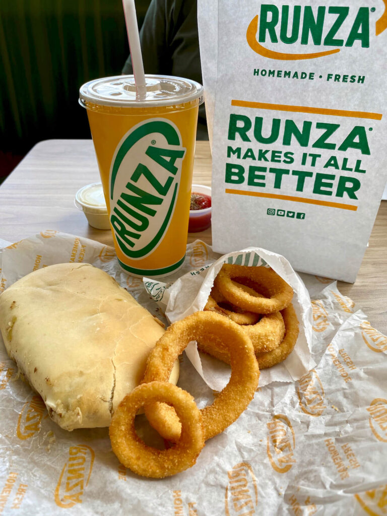 Runza Restaurant meal with a Runza sandwich, onion rings, and drink