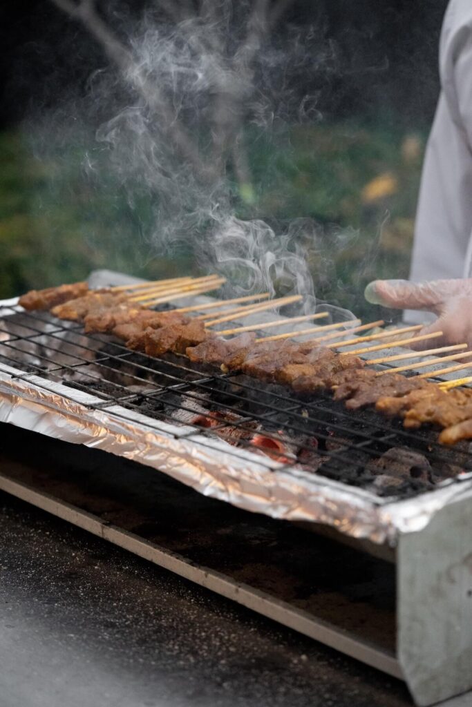 skewered meat on grill