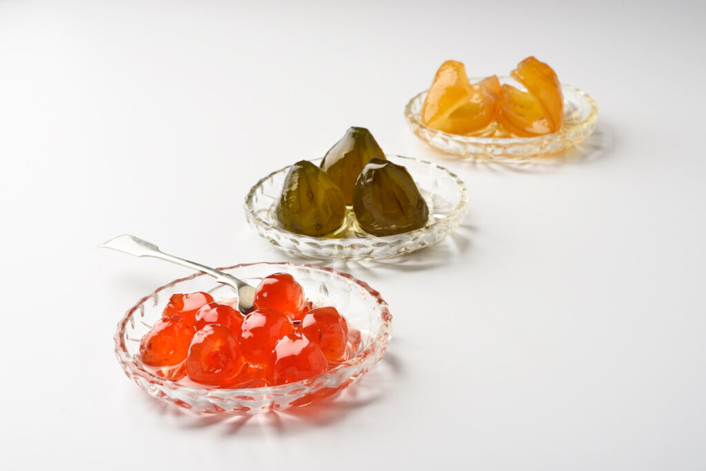 variety of traditional Greek spoon sweet fruits cherry fig bergamot isolate