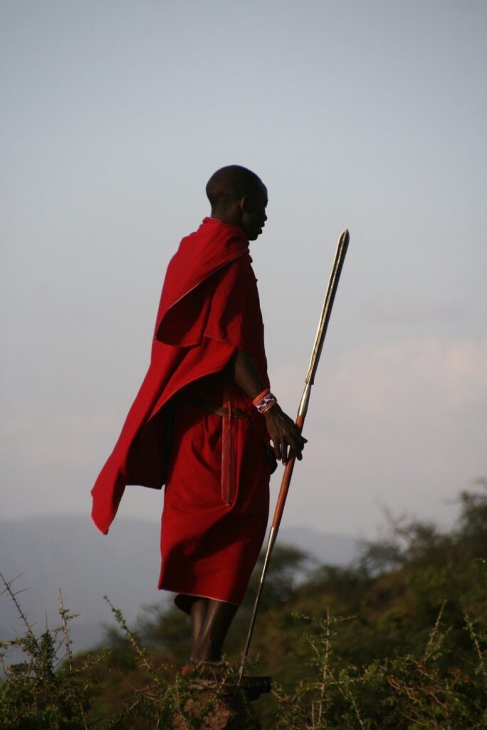 Maasai tribesman draped in red