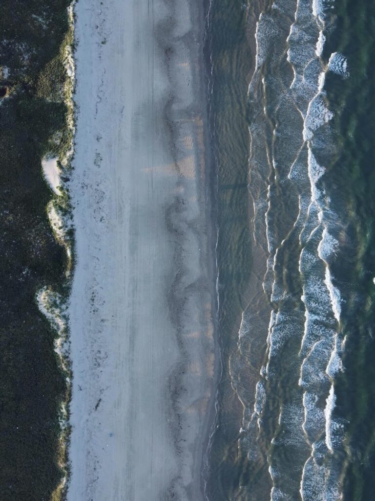 Aerial view of waves on beach