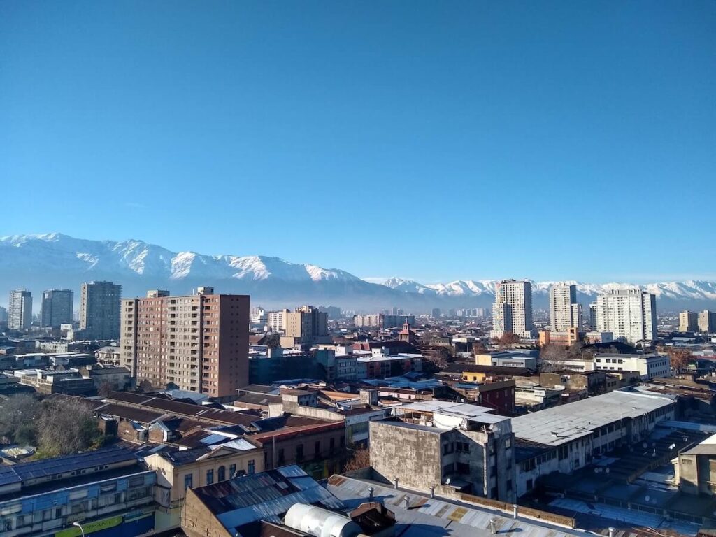 snow capped andes peaks behind santiago