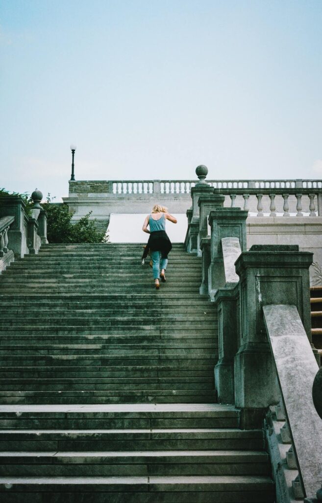 woman climbing stairs at Ault Park