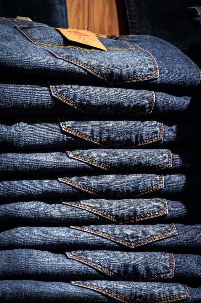 pile of blue denim jeans