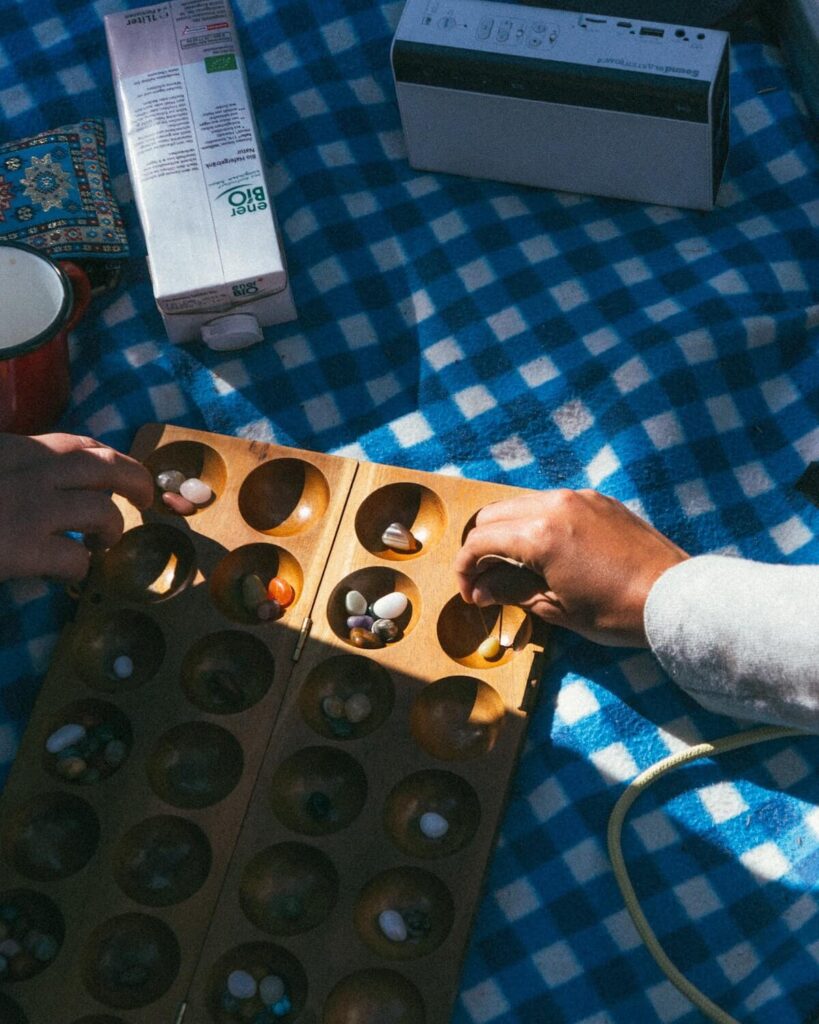 wooden game called congkak in Malaysia