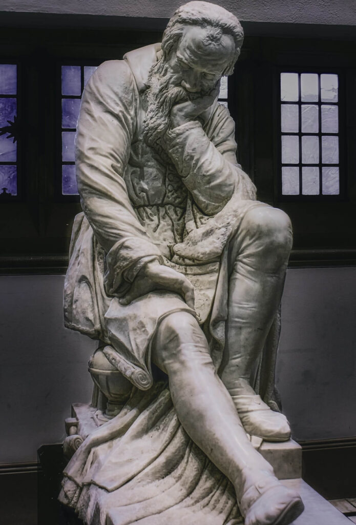 Marble sculpture of Galileo Galilei contemplating the nature of the universe, in Belfast