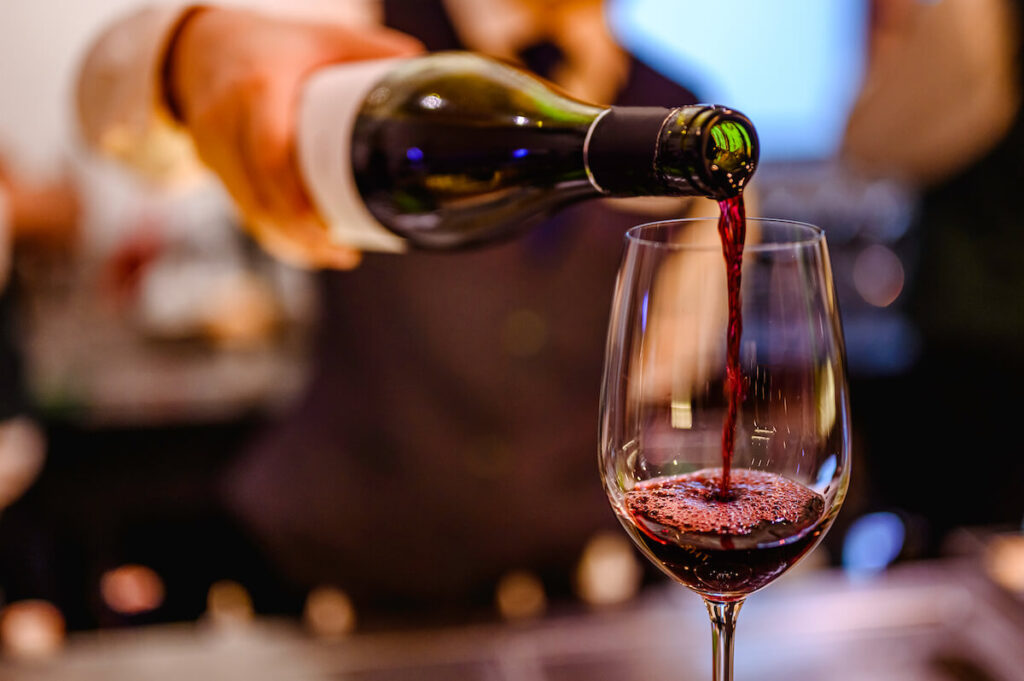 red wine poured into a wine glass