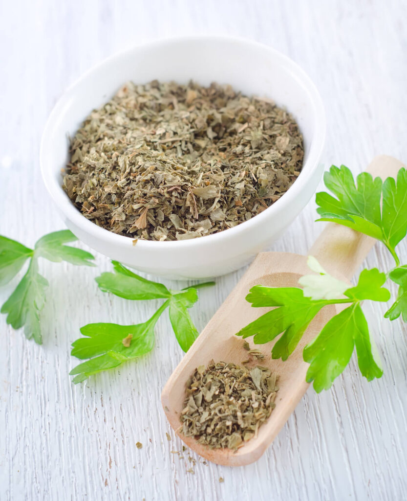 Dry parsley on wooden table