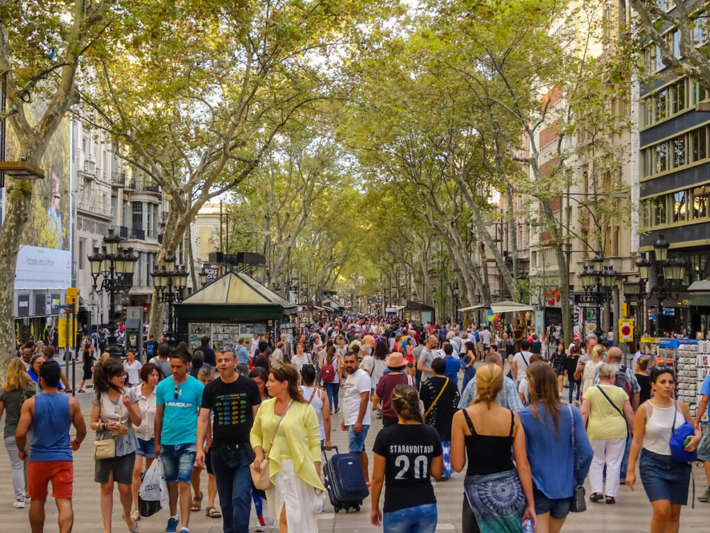 people in downtown Barcelona in popular La Rambla street