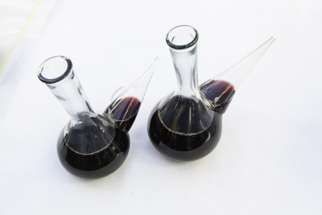Glass container with wine, detail of typical Spanish vessel