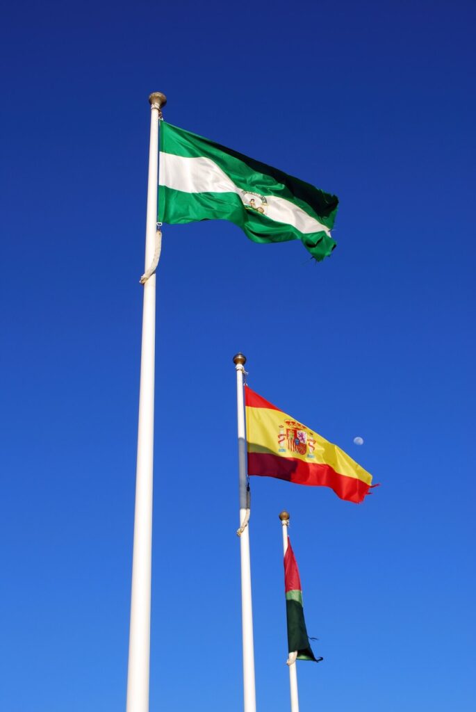Three flagpoles in Malaga Province, Andalusia, Spain