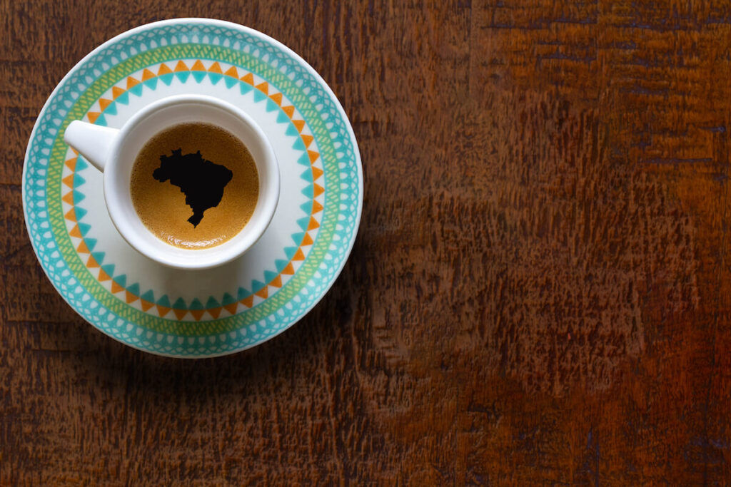 cup of black coffee with map of Brazil