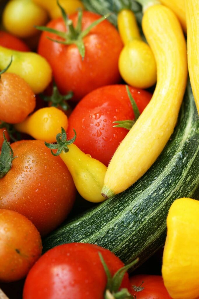 Closeup of tomatoes, zucchini, and other veggies