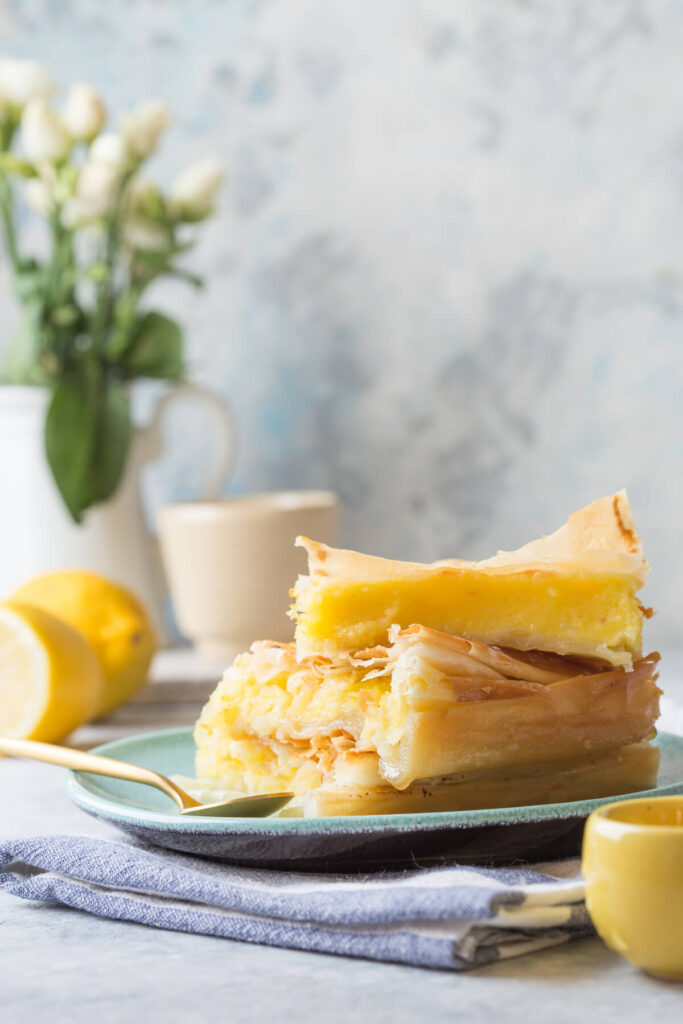 Custard of "Galaktoboureko" or bougatsa Greek traditional dessert baked in a pan with syrup