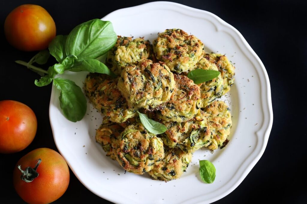 Vegetarian zucchini balls on black background