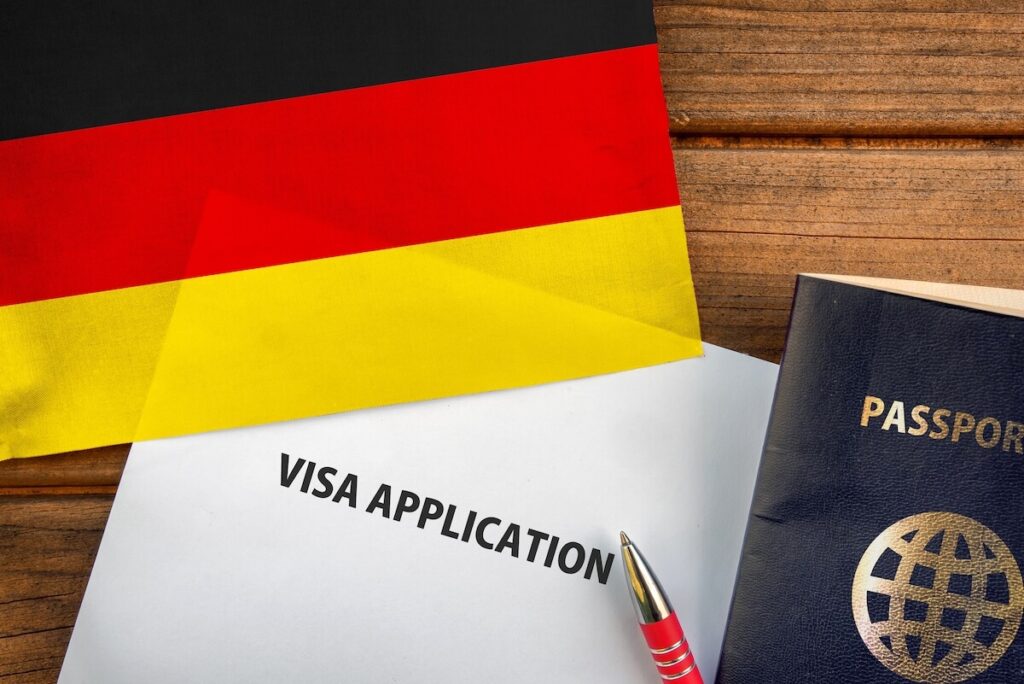 Visa application form, passport and flag of Germany