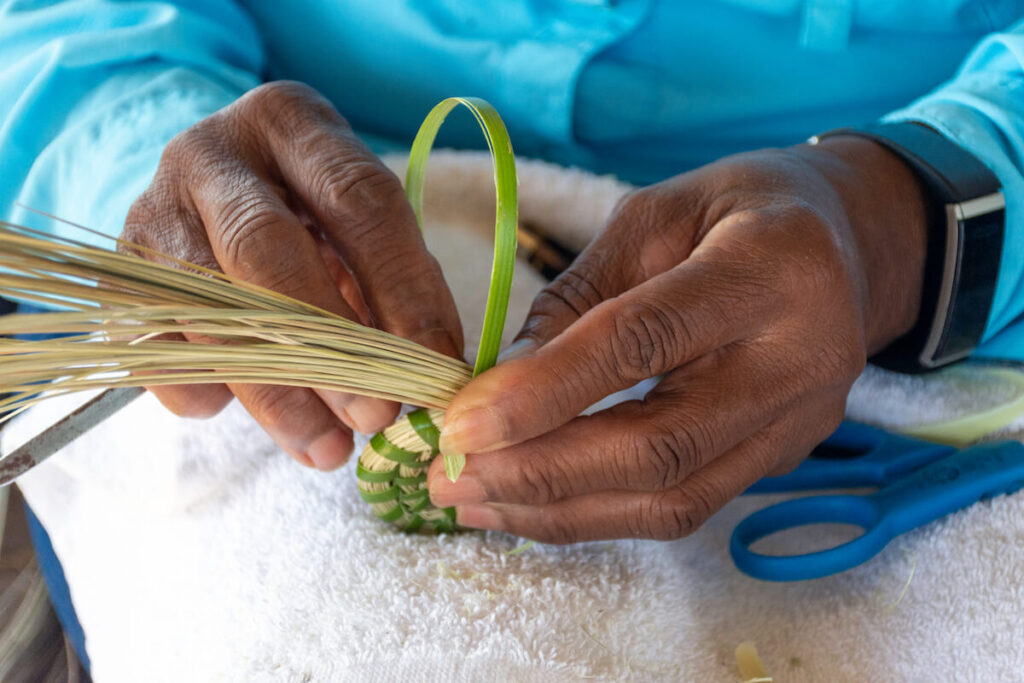 Woman weaving traditional basket
