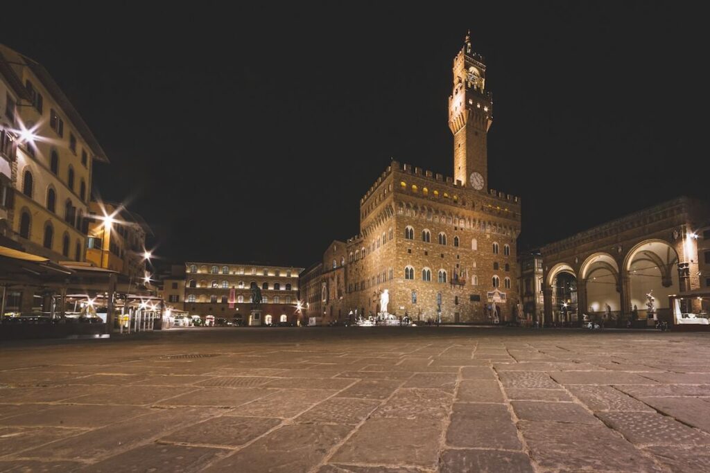 empty piazza della signoria and palazzo vecchio at night