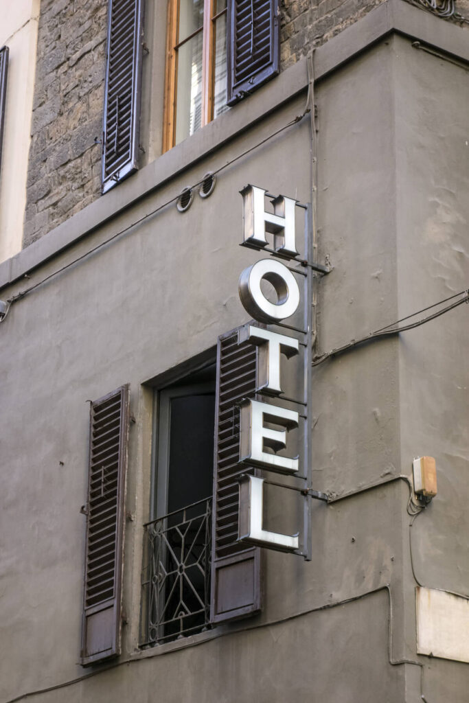 Hotel sign closeup on the wall in Florence, Italy