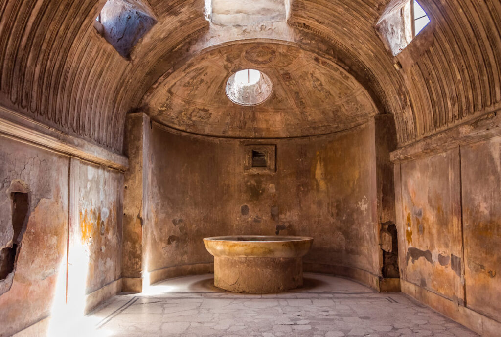 The interior of main public baths in ruins of the Ancient Roman city Pompeii, Campania region, Italy