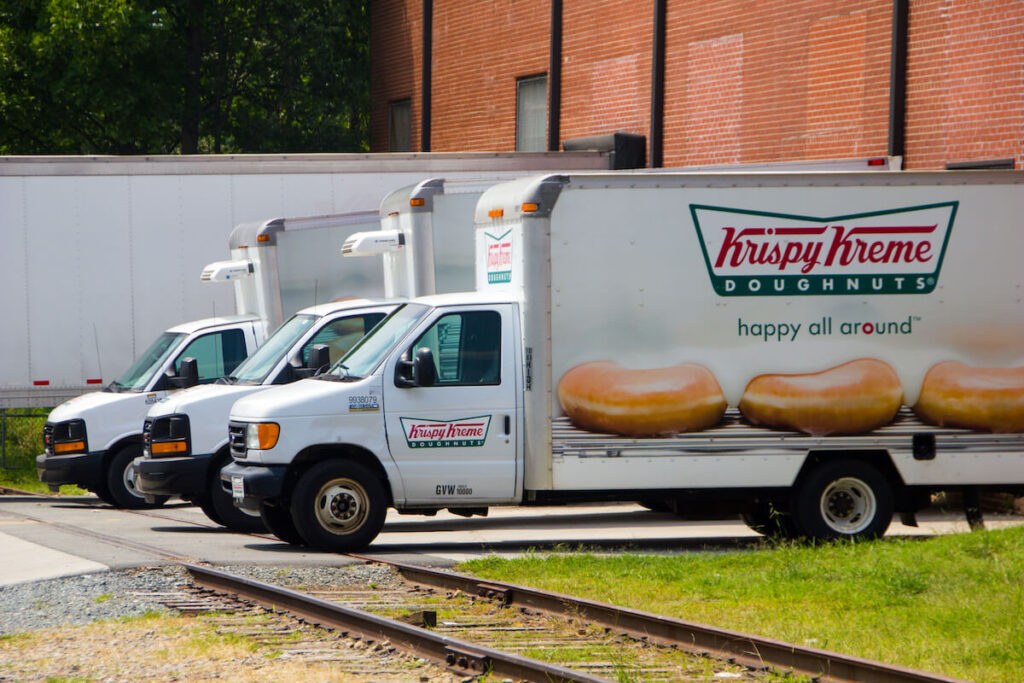 Krispy Kreme trucks ready to deliver freshly baked donuts to shops from the headquarters in Winston-Salem