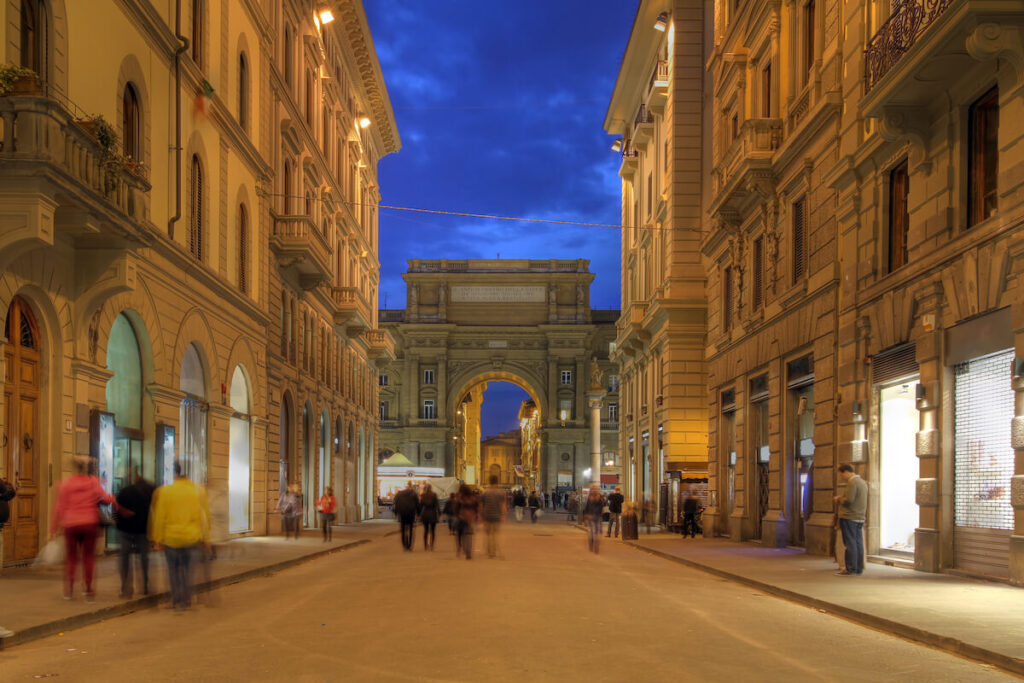 Via degli Speziale leading towards the Republic Square (Piazza della Repubblica) and the Arch ("Arcone") in Florence, Italy at night
