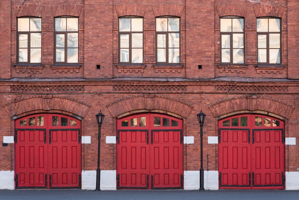 Fire station, an old historic brick building (1880s) with red gates