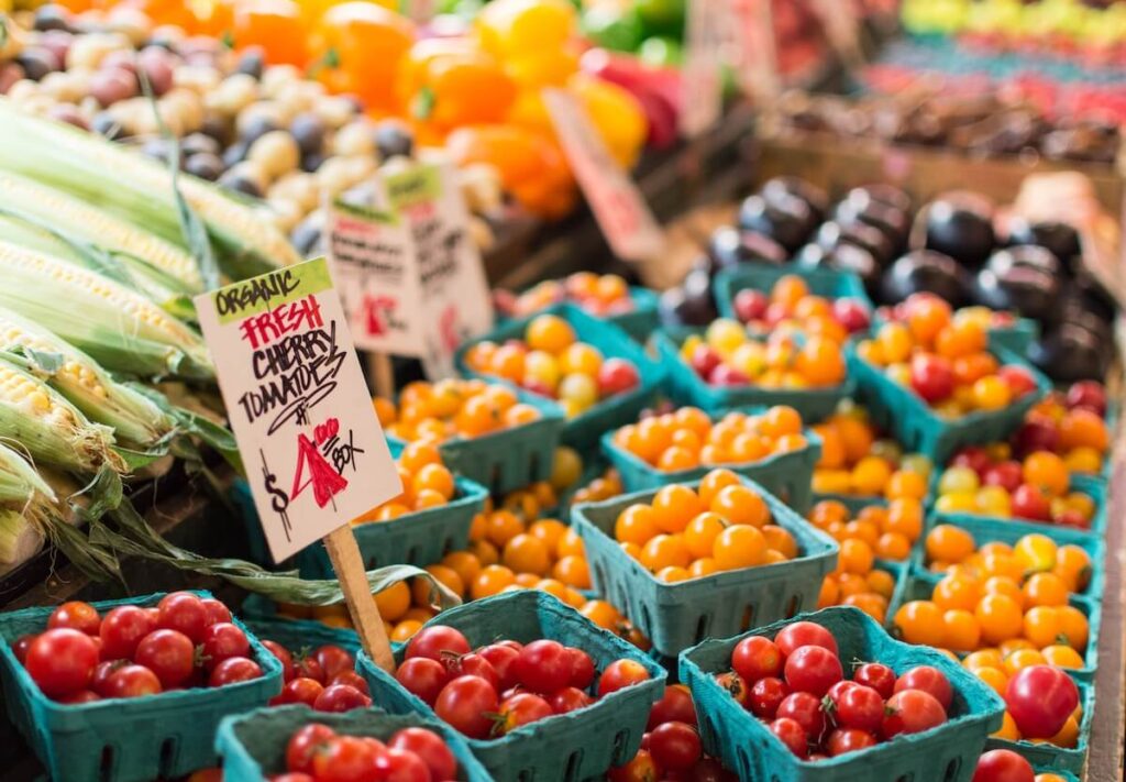 tomatoes on display at a farmer’s market
