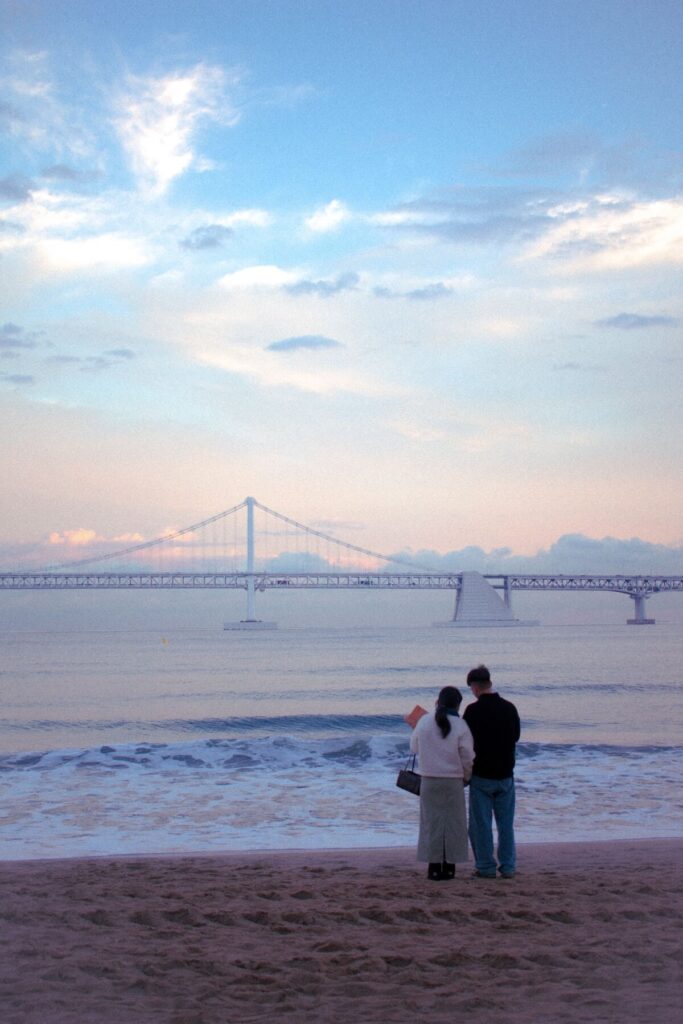 couple at Gwangalli Beach at dusk