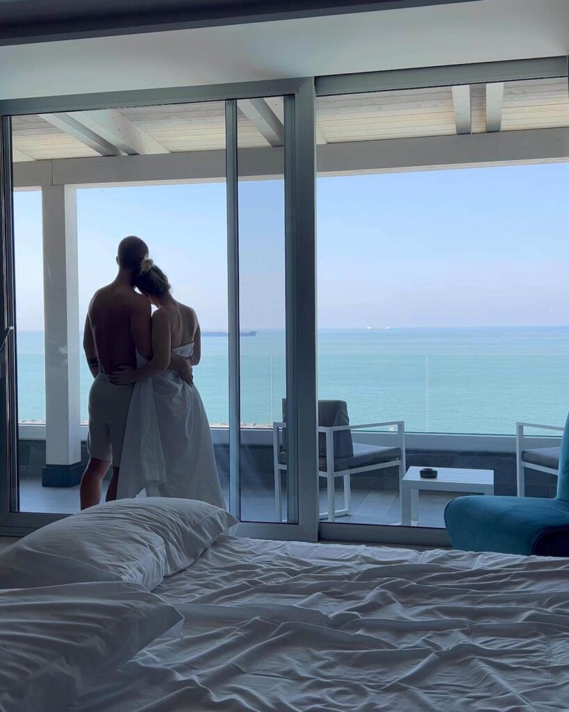 couple in room with sea view