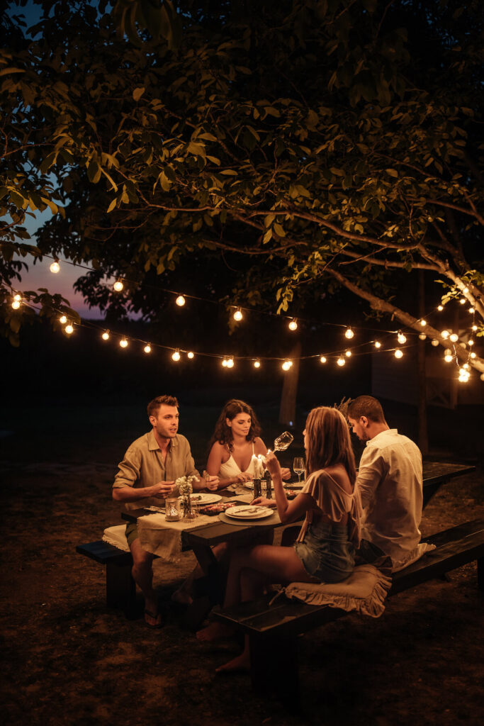friends having dinner in the backyard