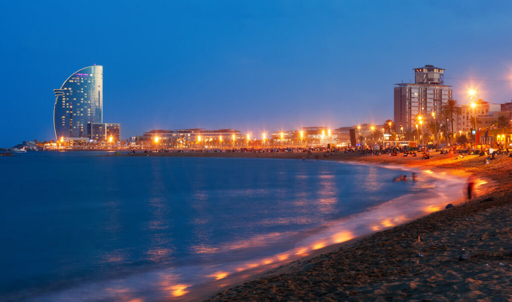 View of Barceloneta Beach in summer night in Barcelona, Spain