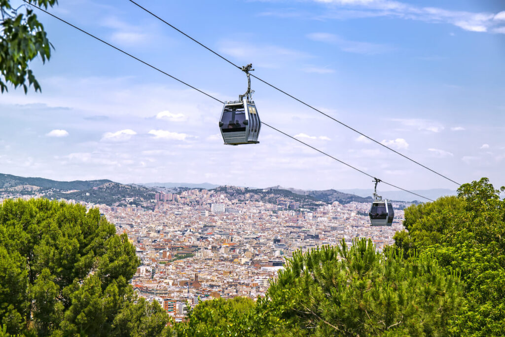 Cable way against Barcelona aerial landscape, Spain