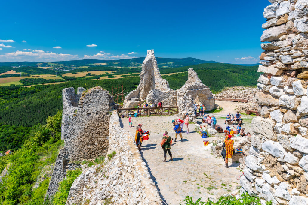 tourists visiting the ruins of medieval castle Čachtice, known for being the residence of Countess Elizabeth Báthory