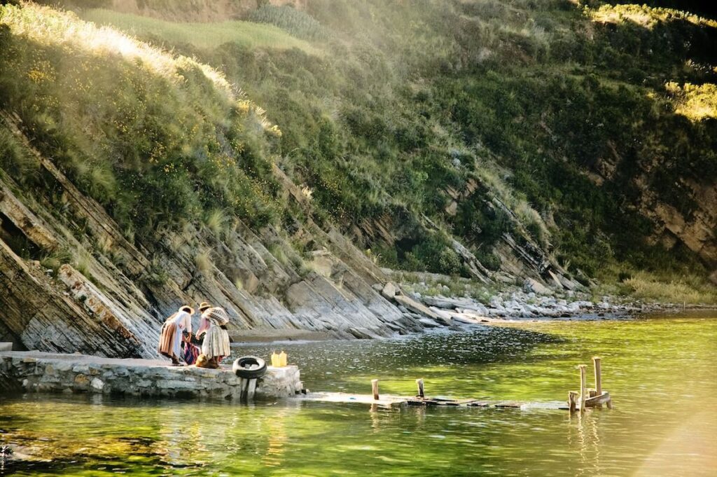 indigenous women working by river
