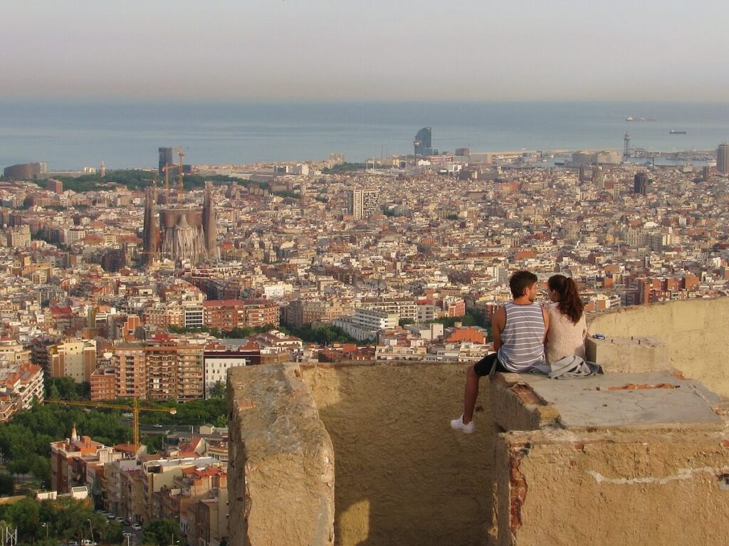 couple in Barcelona watching sunset on the hill