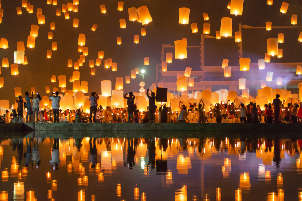 People release Khom Loi, the sky lanterns during Yi Peng or Loi Krathong festival in Chiang Mai, Thailand