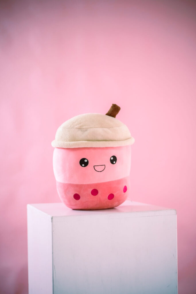 Boba plushy on top of white box