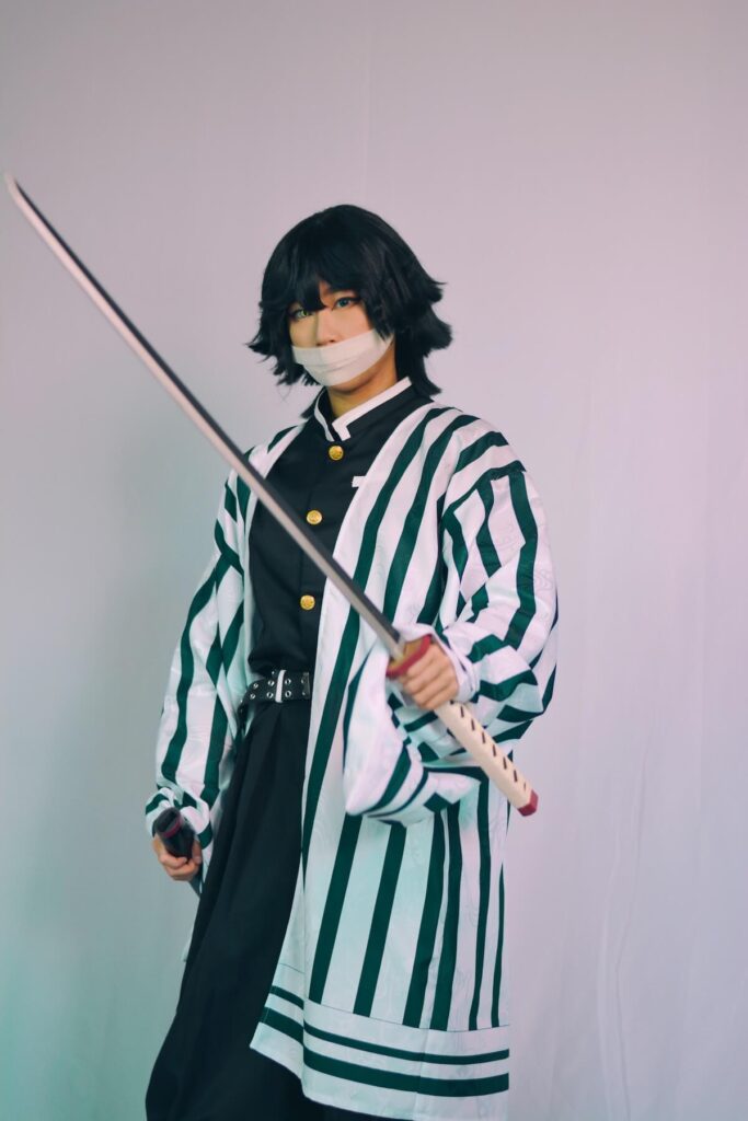 a man in anime cosplay holding a sword