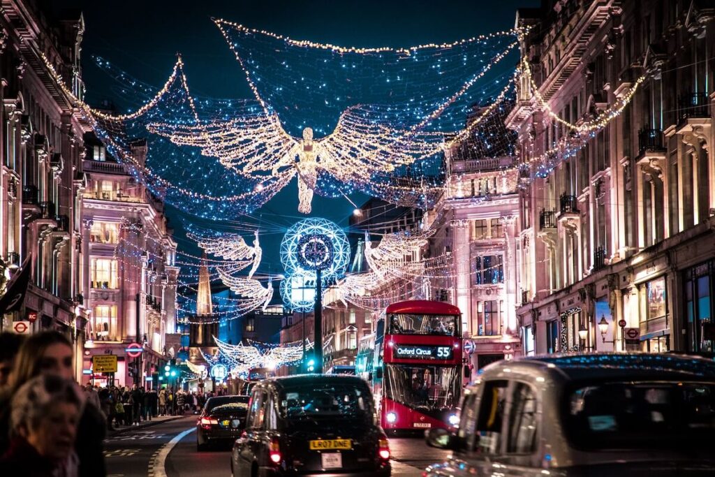 christmas lights over busy london street