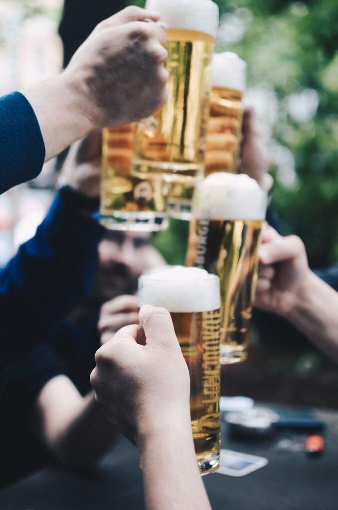 Group cheering with foamy light beer