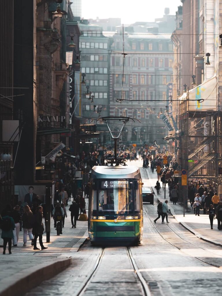 Tram coming up city street in Helsinki