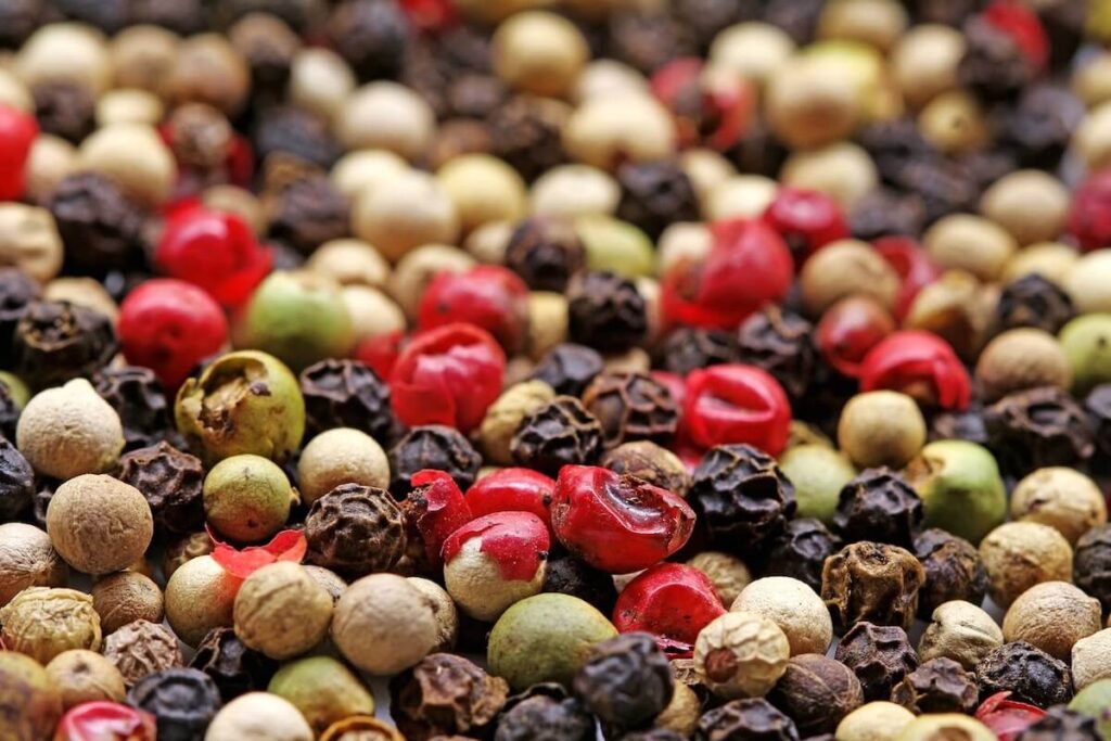 Red black, and white pepper kernels