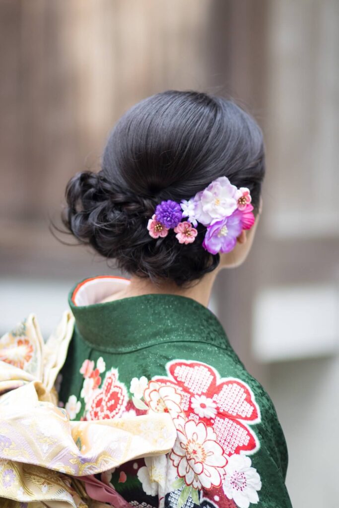 woman in colorful kimono and floral hair ornament