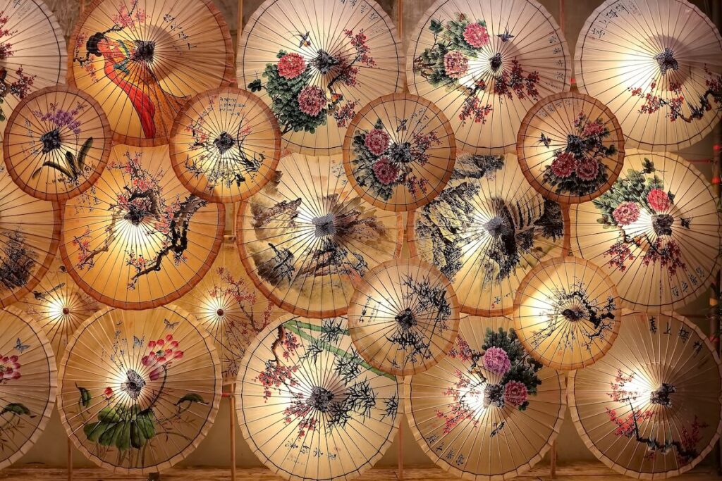 oiled paper umbrellas hang on the wall at Beigang Lantern Festival