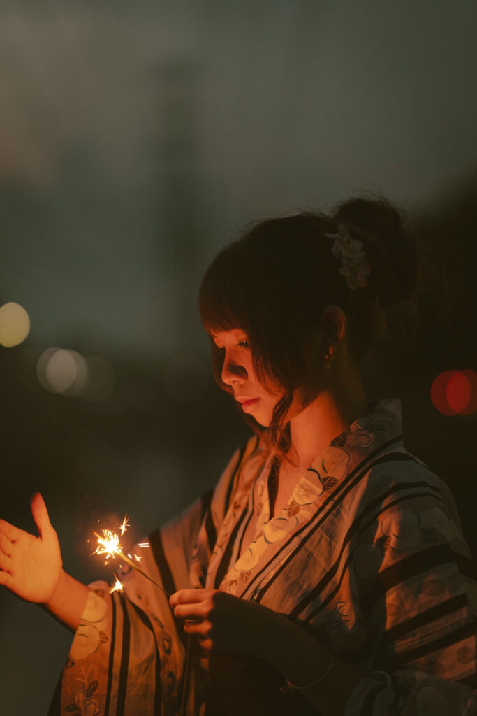 A girl in yukata with sparkler