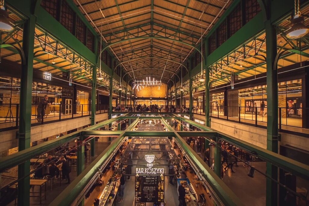 Modern interior of rebuilt shopping center Hala Koszyki in Warsaw, Poland
