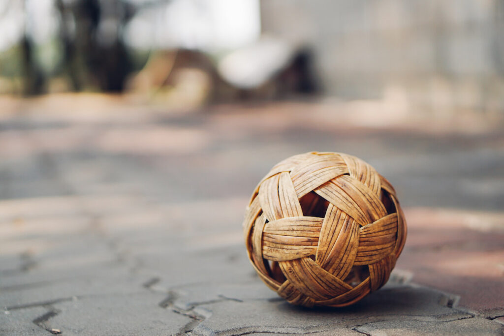 Sepak Takraw ball on pavement tiled bricks