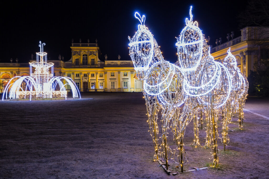 Christmas illuminations in the park in Wilanow Palace at night