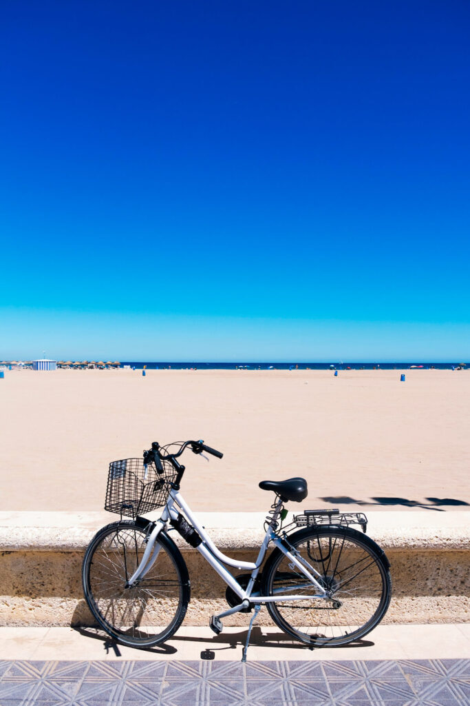 Bicycle parked by the La Malvarrosa beach, Valencia, Spain